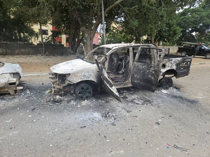 Burnt out patrol truck and an injured police personnel during the clash with members of the proscribed Islamic Movement of Nigeria, IMN, otherwise known as Shi'ites, in Abuja on Sunday, August 25, 2024.
