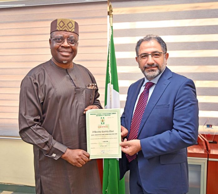 (L-R) Dr Olufemi Ogunyemi MD/CEO NEPZA delivering the zone's OPL to MrAdil Kurt, MD of ZEBERCED.