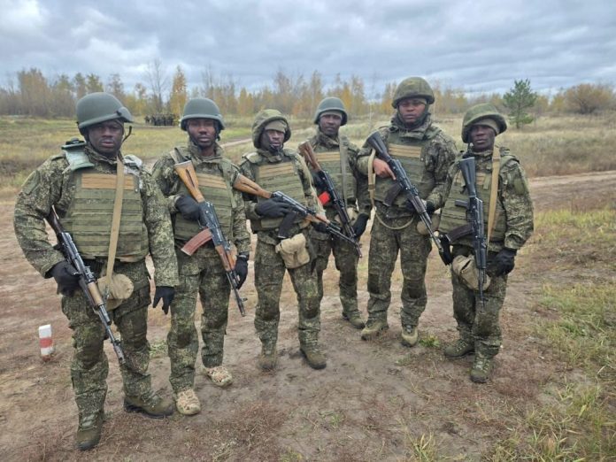 Six Nigerians, inlcuding a former member of the Nigerian AirForce, wielding Russia's AK74M and reportedly fighting for the Russian Army