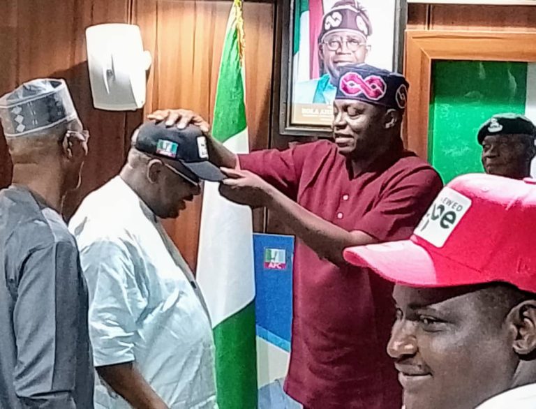 Aduda defects to APC, receives party cap, vows FCT victory for Tinubu in 2027
